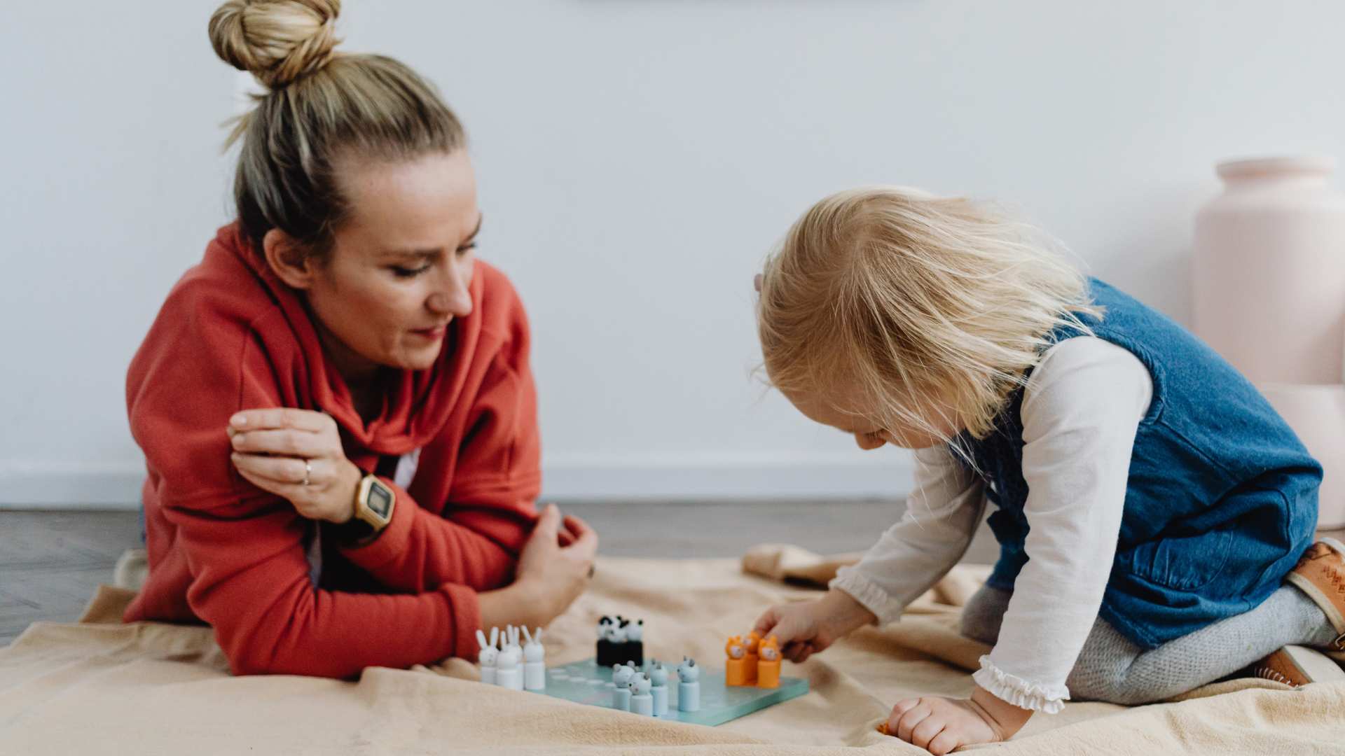 A child and clinician practicing a learning activity as part of autism ABA support