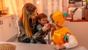 A child with autism enjoying an inclusive Halloween celebration.