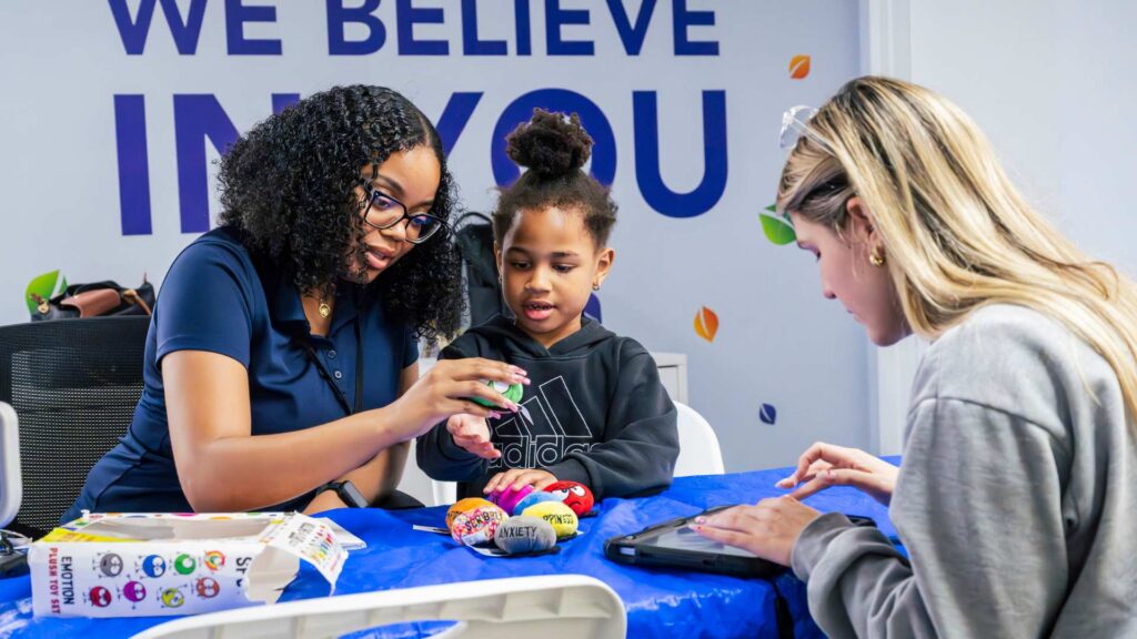 ABA professional with kid in session