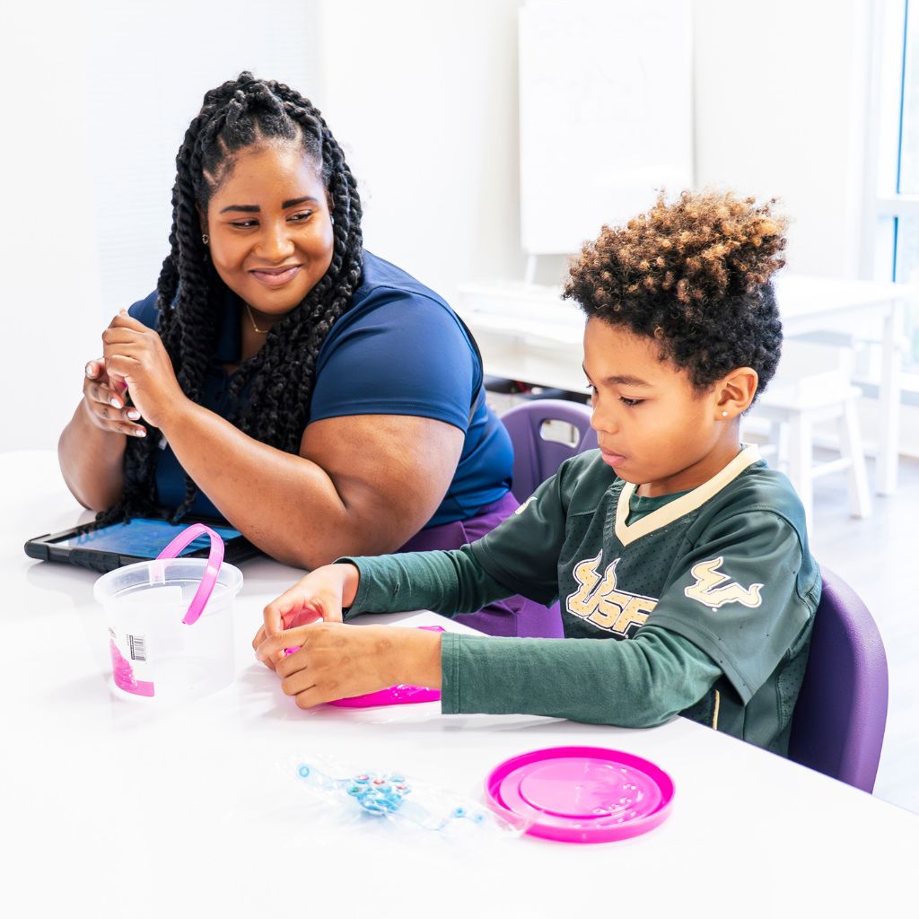 ABA therapist supporting a child during an ABA session