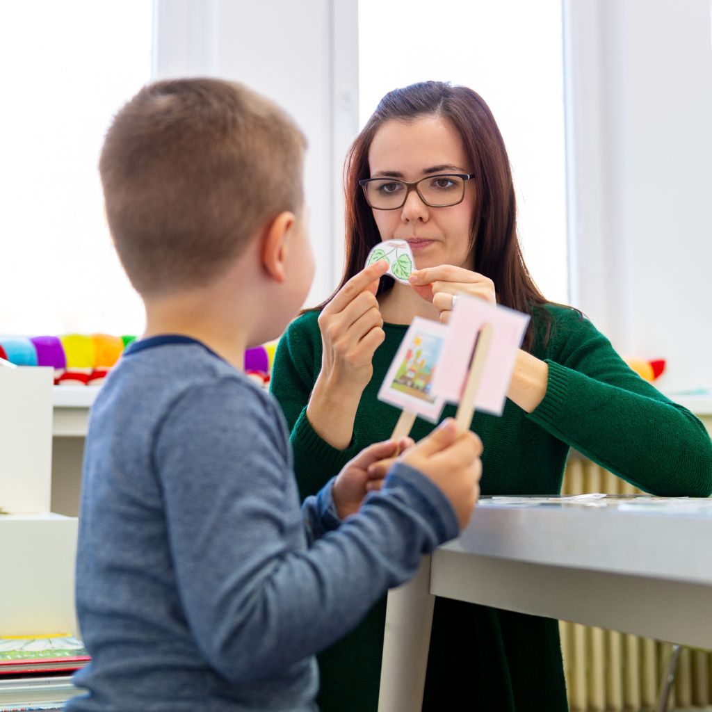 Child participating in ABA therapy for preschoolers using visual supports to build communication and language skills.