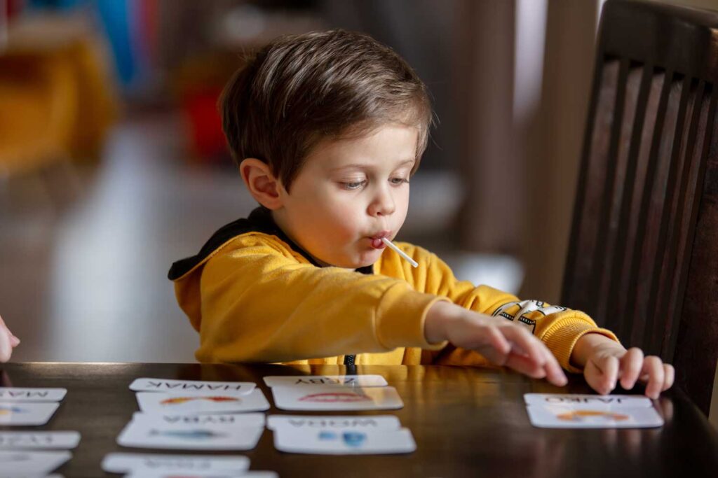 Child playing with cards