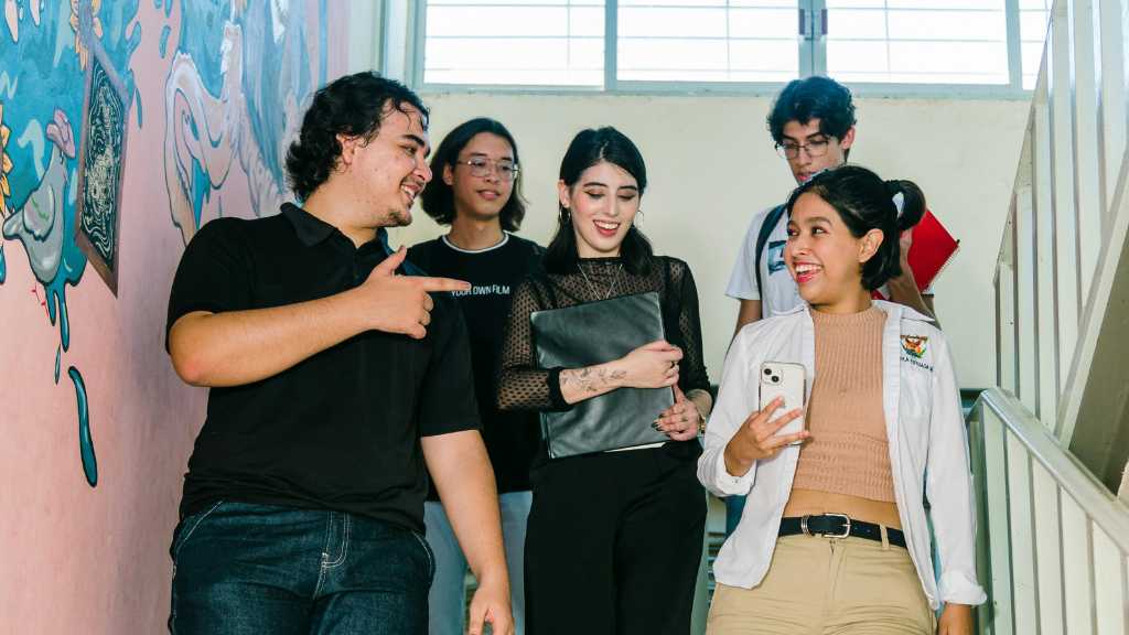 Group of teenagers walking and talking together, representing how self-advocacy skills help teens with autism express their needs respectfully and clearly.
