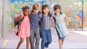 Children walking together representing levels of autism, including level 1 autism, level 2 autism, and level 3 autism