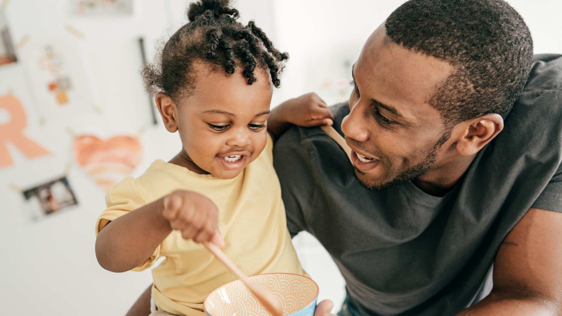 Little child chatting happily with her parent