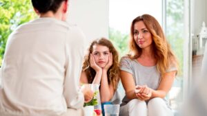 Mother and child speaking with a professional, showing concern that an ABA provider is not the right fit