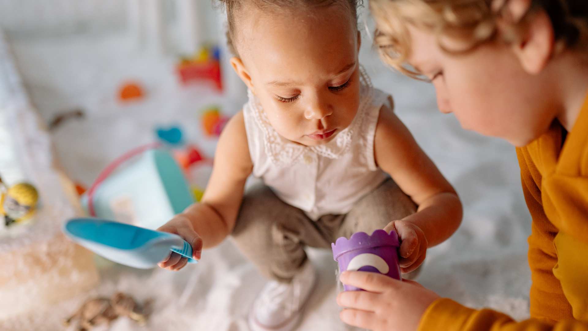 Toddlers interacting during play, highlighting Social Developmental Milestones
